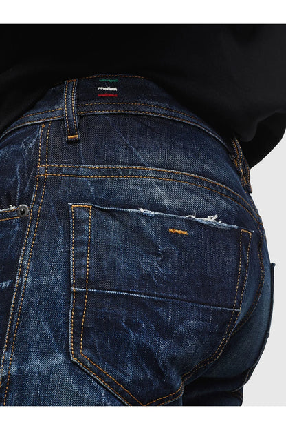 Men's indigo jeans back pocket with orange stitching and distressed denim