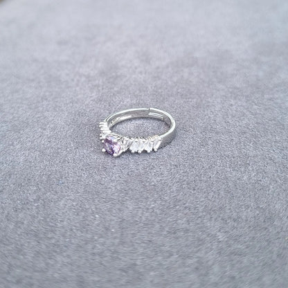 Silver-tone ring with lavender teardrop center gemstone and white fringe detailing