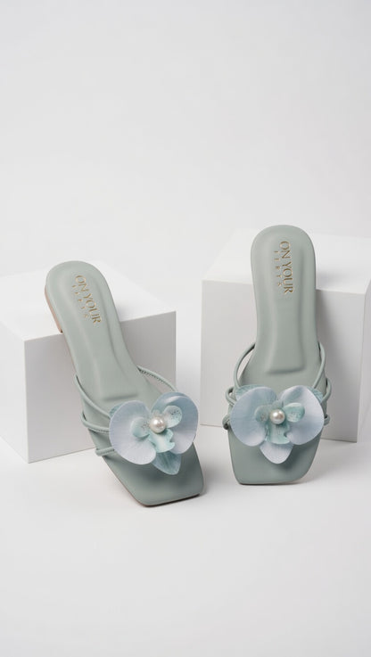 Sea green heeled sandals with flower and pearl embellishment