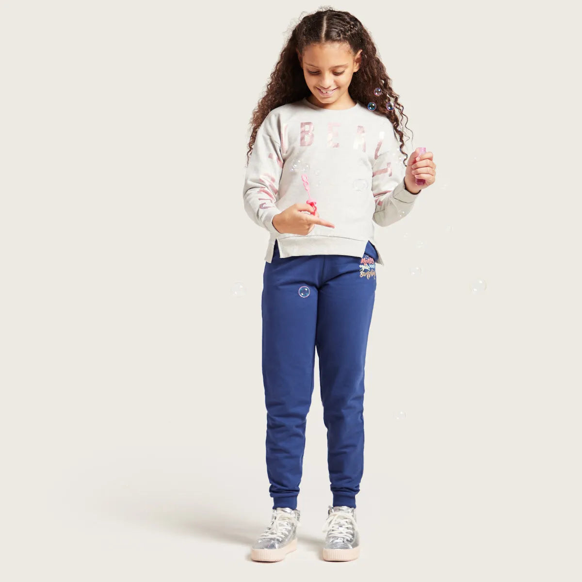 Kids blue jogger pants with drawstring and 'Make your own sunshine' front print