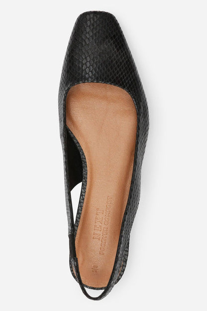 Black textured pointed-toe flats with visible tan insole