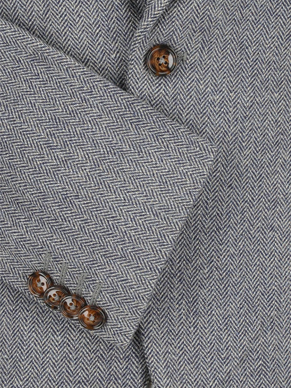 Herringbone grey blazer fabric close-up with brown button