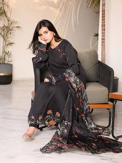 Nazmina black long dress with floral-print dupatta draped over shoulder, long sleeves
