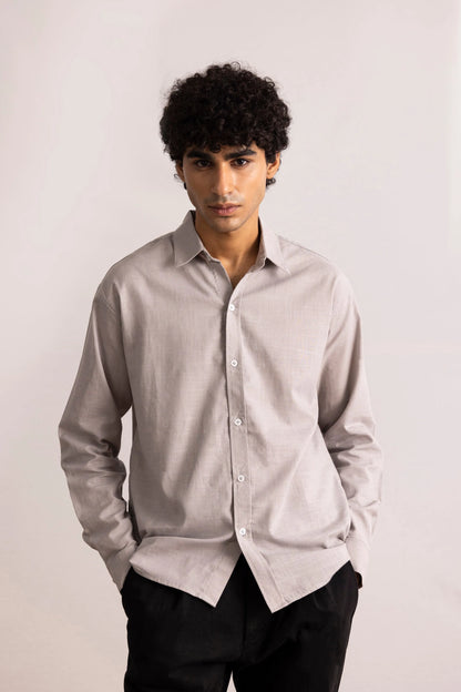 Grey button-up shirt on model, long sleeves, button front, pointed collar