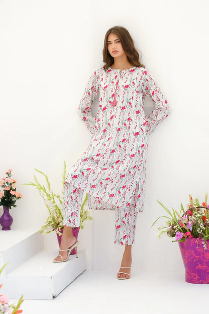 White floral maxi dress with long sleeves and gathered ruffle neckline