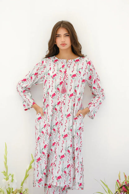 White floral maxi dress with long sleeves and elastic cuffs, gathered yoke