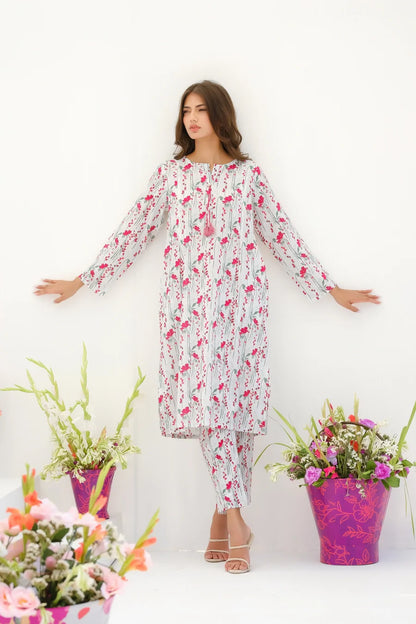White floral maxi dress with loose fit, long sleeves, gathered neckline
