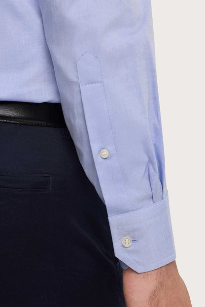 Light blue dress shirt cuff with single button and buttoned placket detail