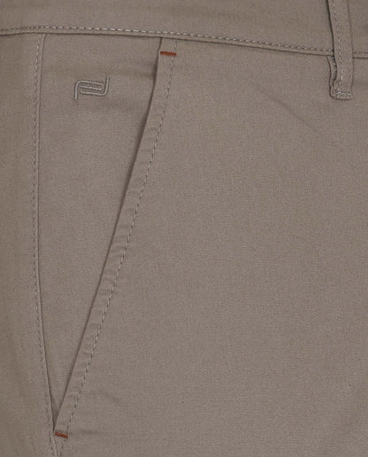 Light grey trouser pocket with contrast stitching and curved seam