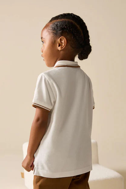 Children's white polo shirt, back view, brown-striped collar trim