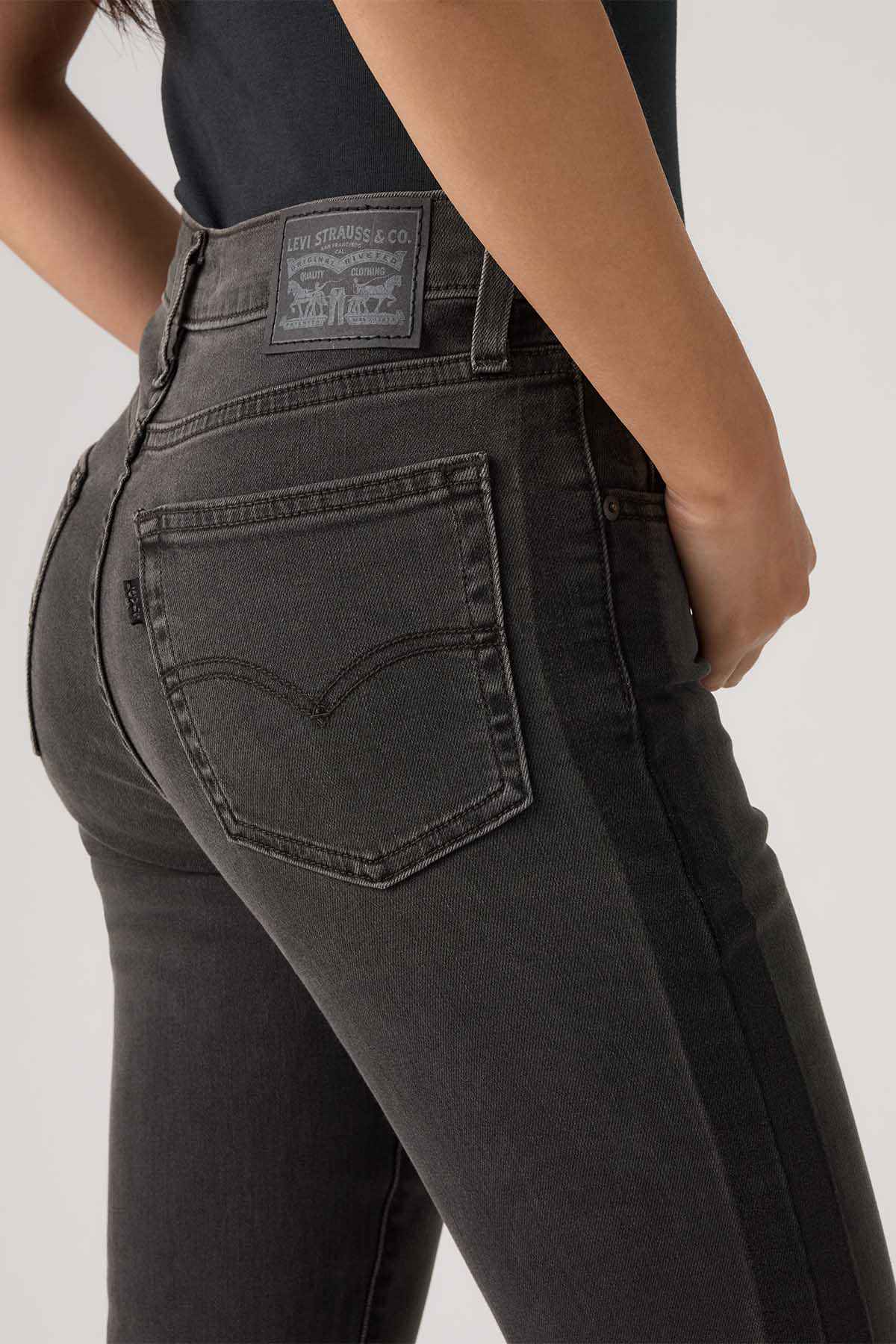 Levi's dark wash denim jeans with stitched front pocket detail
