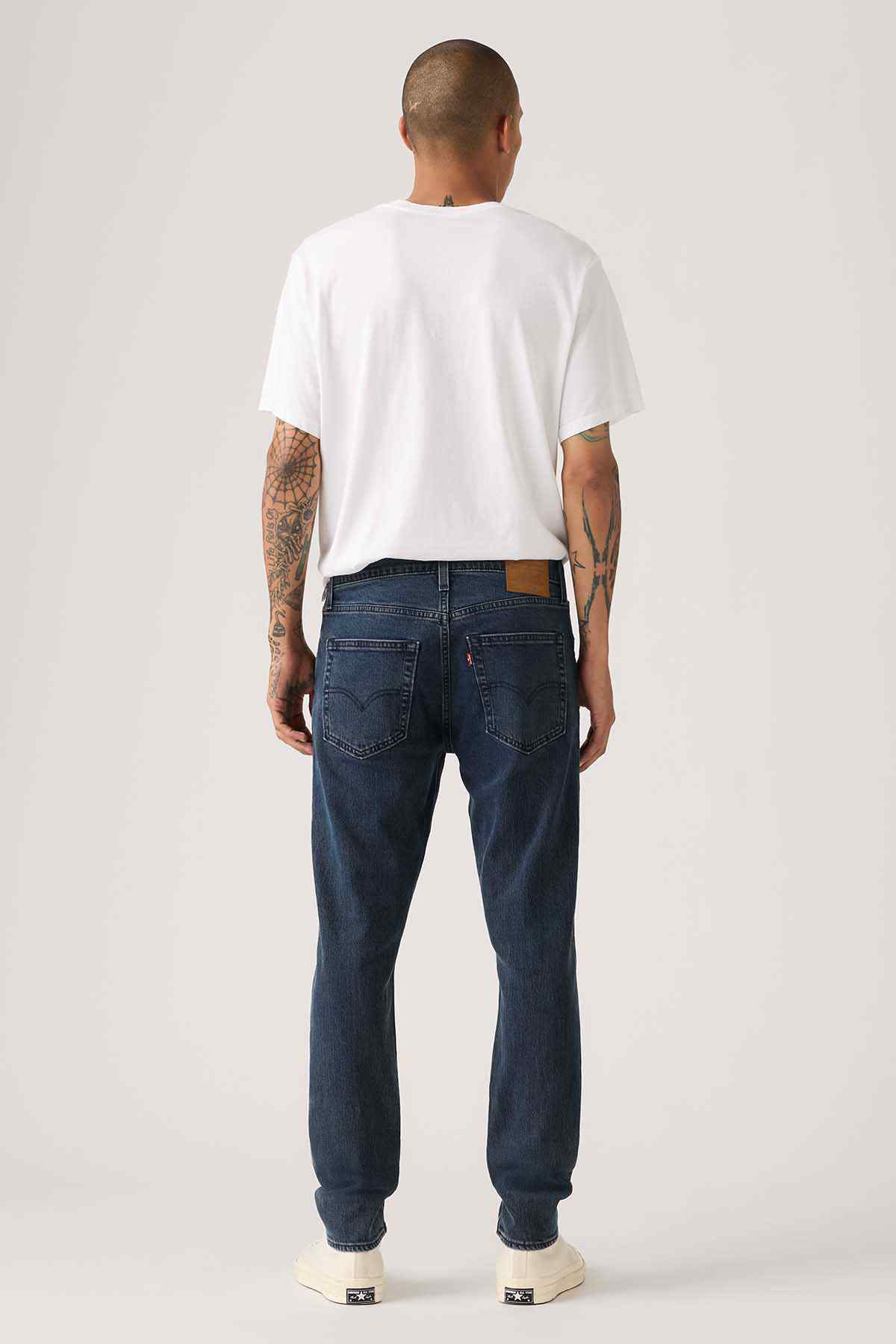 Levi's dark blue straight jeans, back view with patch pockets