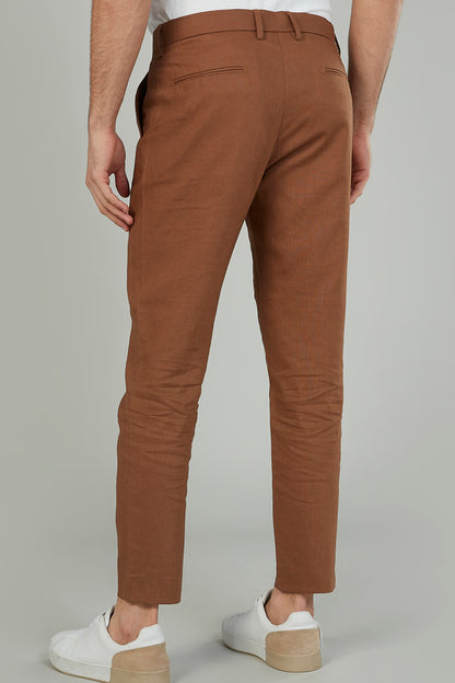 Brown chino pants rear view with belt loops and back pocket stitching