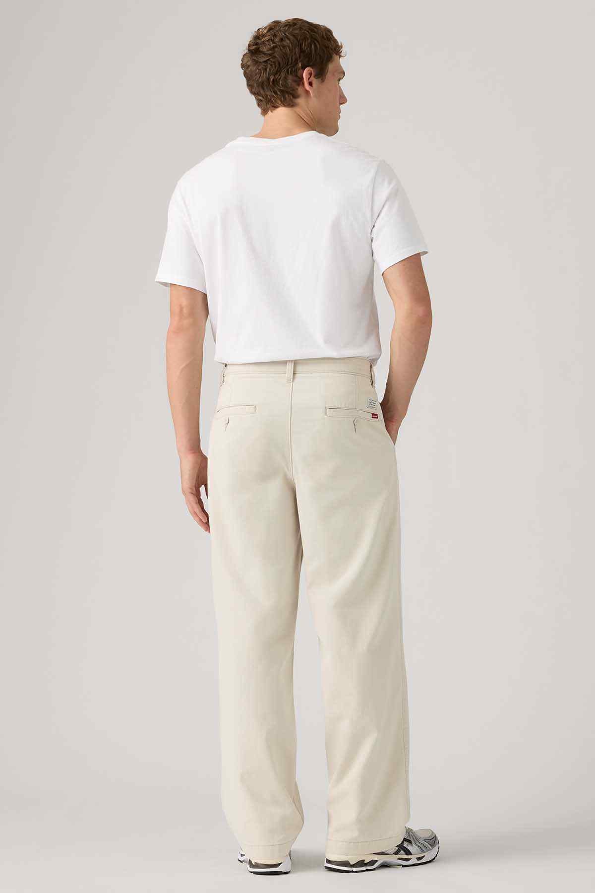 Levi's white crew-neck T-shirt with light beige pants, back view