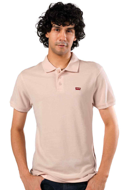 Pink polo shirt with collar, button placket, short sleeves, chest logo