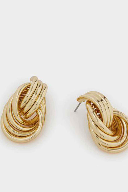 Gold multi-loop hoop earrings with layered rings, angled close-up