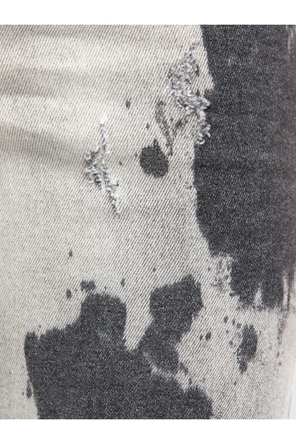 Diesel light grey jeans close-up of dark splatter pattern