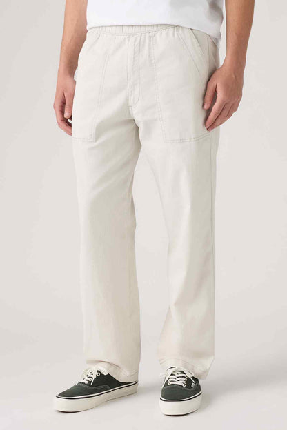 Levi's light beige pants with stitched seams and front patch pockets, straight legs