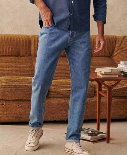 Fitted light-wash denim jeans with straight legs and cuffed ankle hems