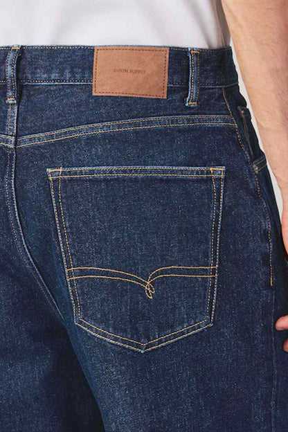 Dark blue denim jeans with logo patch waistband and back pocket stitching