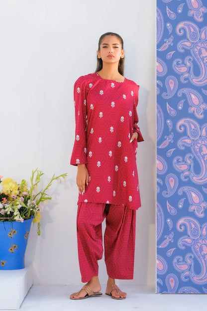 Pink printed kurta with matching patterned pants set, long sleeves and round neckline.