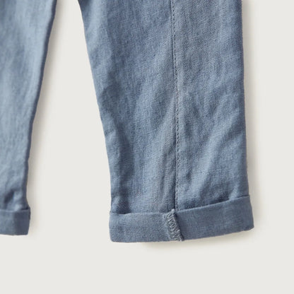 Blue baby trousers cuffed hem with stitched leg seam and textured fabric finish