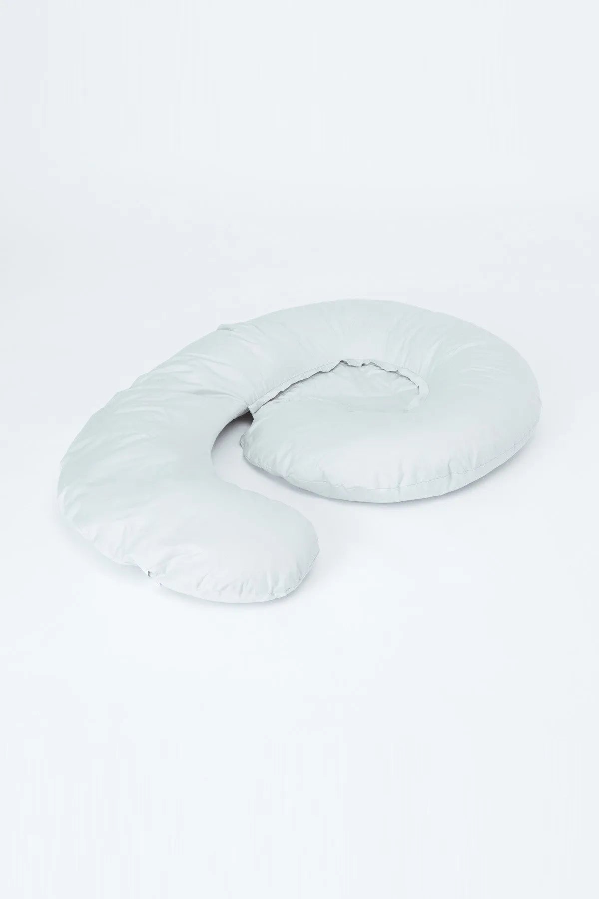 Light grey U-shaped nursing pillow with contoured back support and curved sides