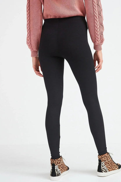 Black slim leggings with elastic waistband and tapered leg openings