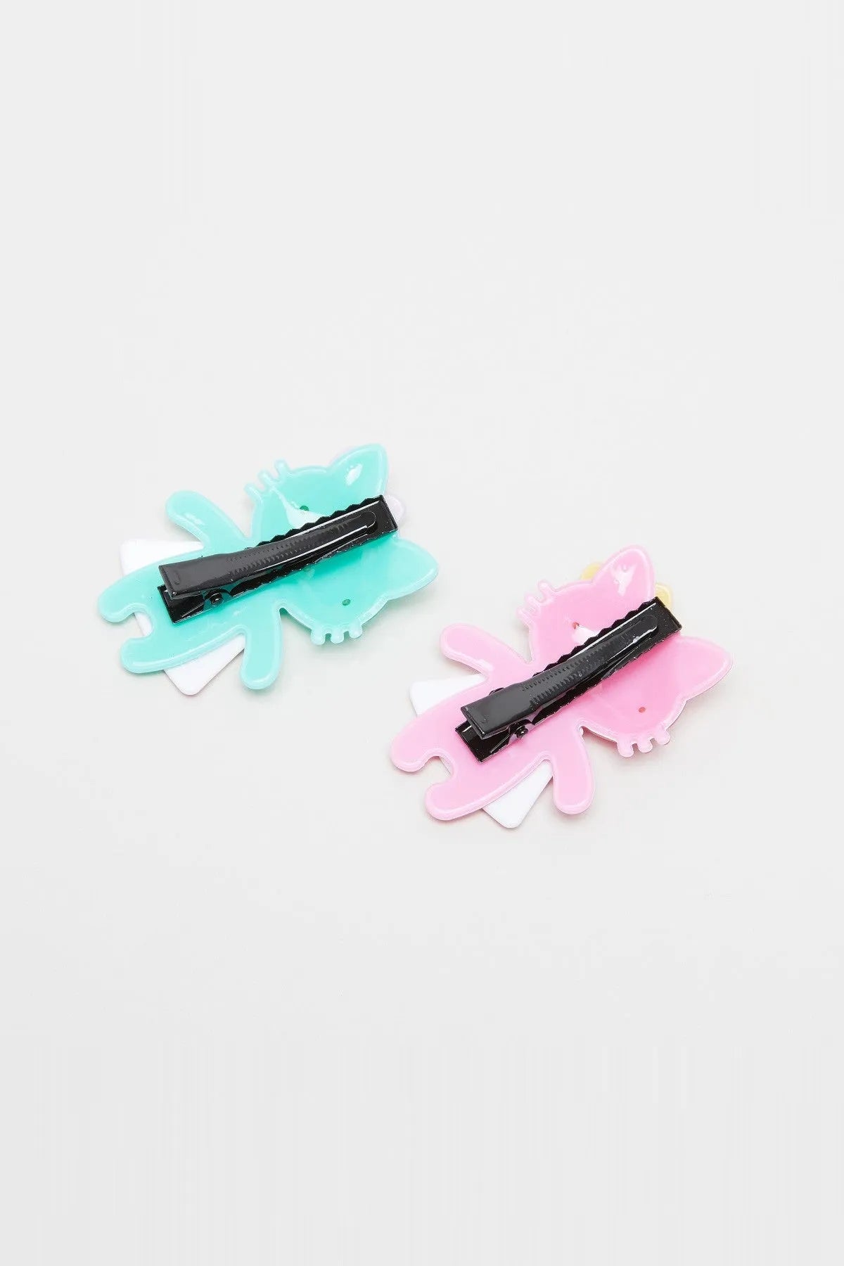 Dinosaur character hair clips with black comb clips, blue and pink