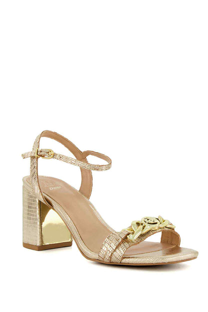 Gold heeled sandal with crisscross straps and sculpted block heel, logo buckle