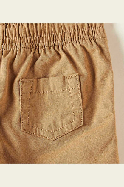 Brown baby shorts with front patch pocket and stitched seams