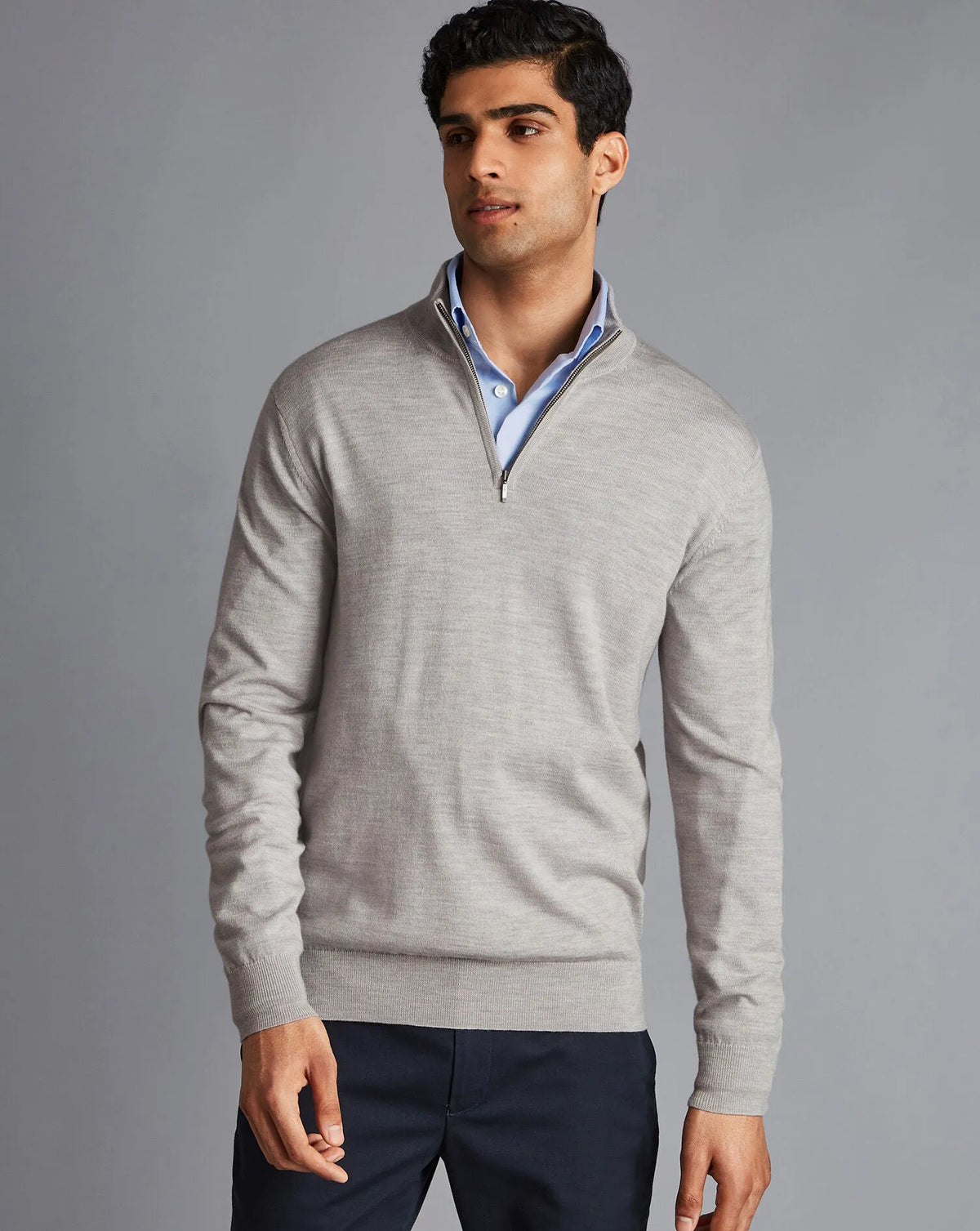 Men's grey quarter-zip knit sweater with ribbed cuffs and collar