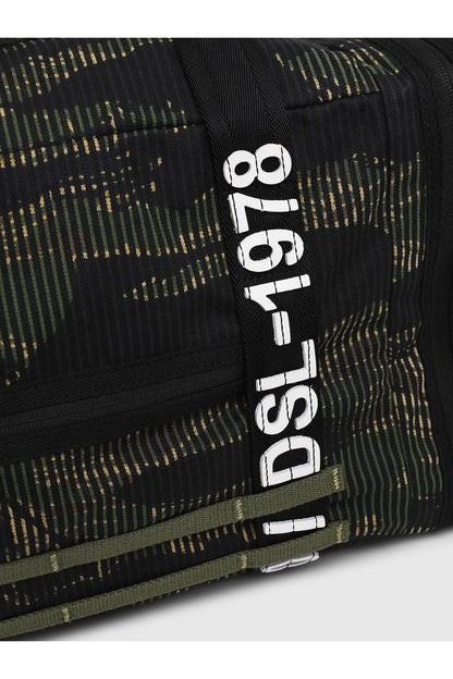 Diesel duffel bag with vertical "Diesel" logo patch on dark patterned fabric