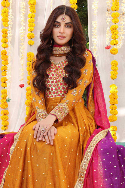 Orange embroidered long dress with gold trims and red-pink dupatta drape