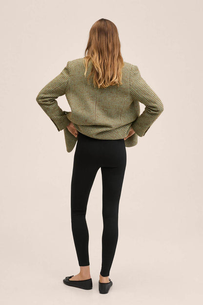 Black slim-fit pants, tapered legs with ankle length from the back