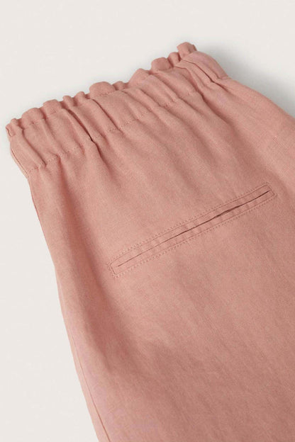 Pink elastic waistband drawstring pants, ruched top and stitched hem detail