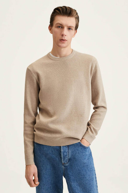 Beige knit sweater with crew neck and long sleeves, straight hem