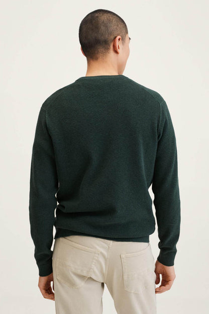 Men's dark green crewneck sweatshirt, back view with ribbed collar, hem and cuffs.