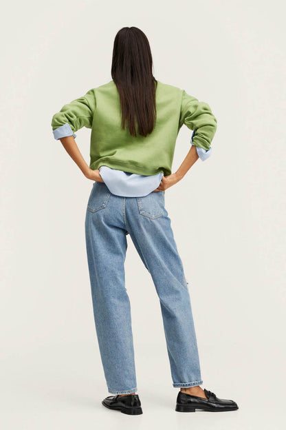 Back view of green crewneck sweatshirt with long sleeves and ribbed cuffs