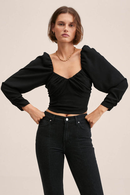 Black ruched corset-style crop top with puff sleeves and sweetheart neckline