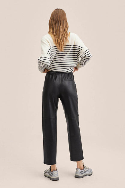 Black trousers, back view, elastic waist and tapered ankle-length fit