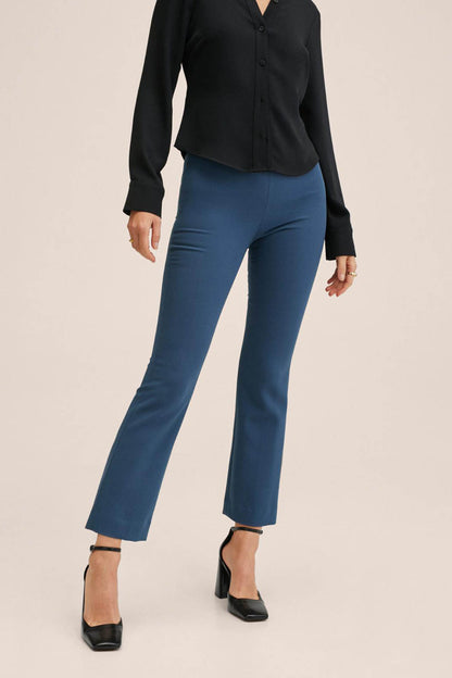 Indigo blue slim-fit jeans with ankle-length straight legs and cuffed hems