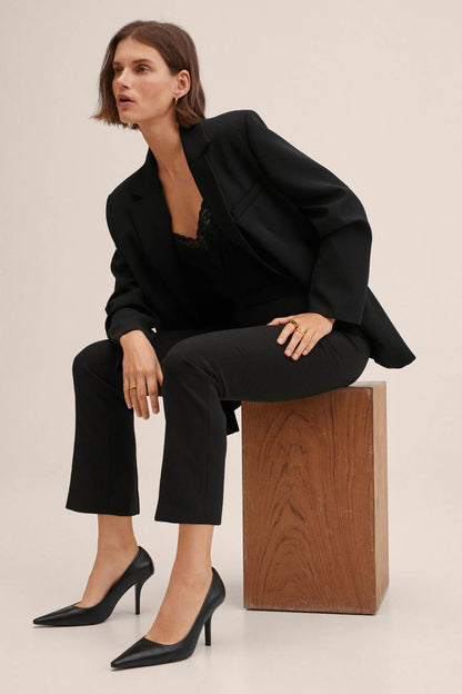 Black blazer with notch lapels and straight-leg trousers