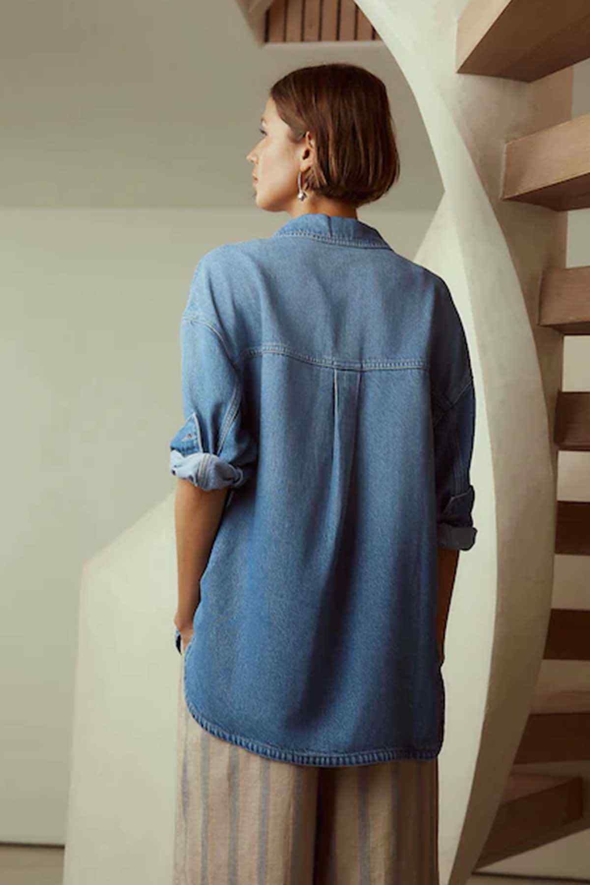 Next mid blue denim jacket back view with button-down yoke and relaxed shoulders