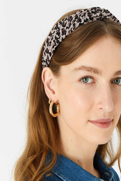Brown leopard-print fabric headband worn around the head