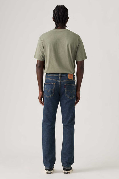 Back view of dark blue denim jeans with straight leg and patch back pockets