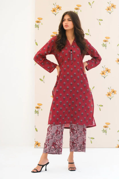 Red floral kurta set with V-neck and wide sleeves, styled with printed trousers