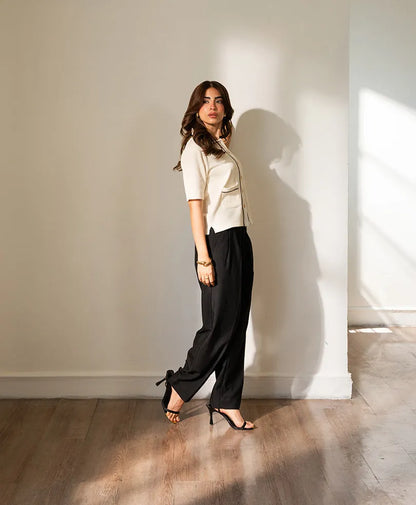 Ivory fitted button-up top with stand collar, short sleeves, and contrast trim.