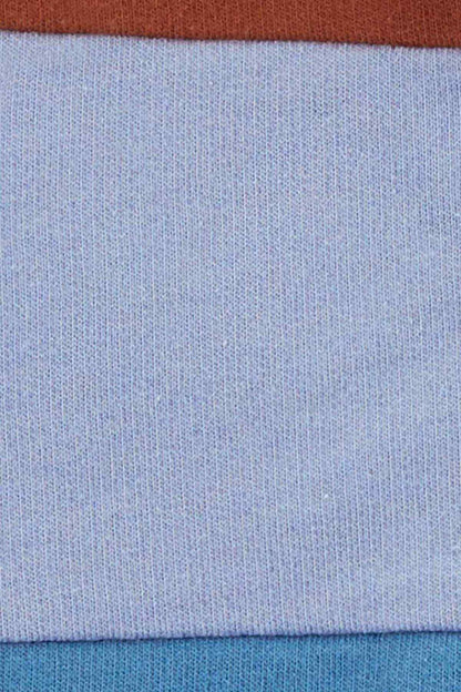 Light blue knit fabric panel with darker blue hem or seam