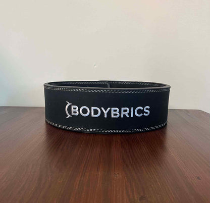 Black exercise belt with Bodybrics logo, stitched edge, adjustable buckle